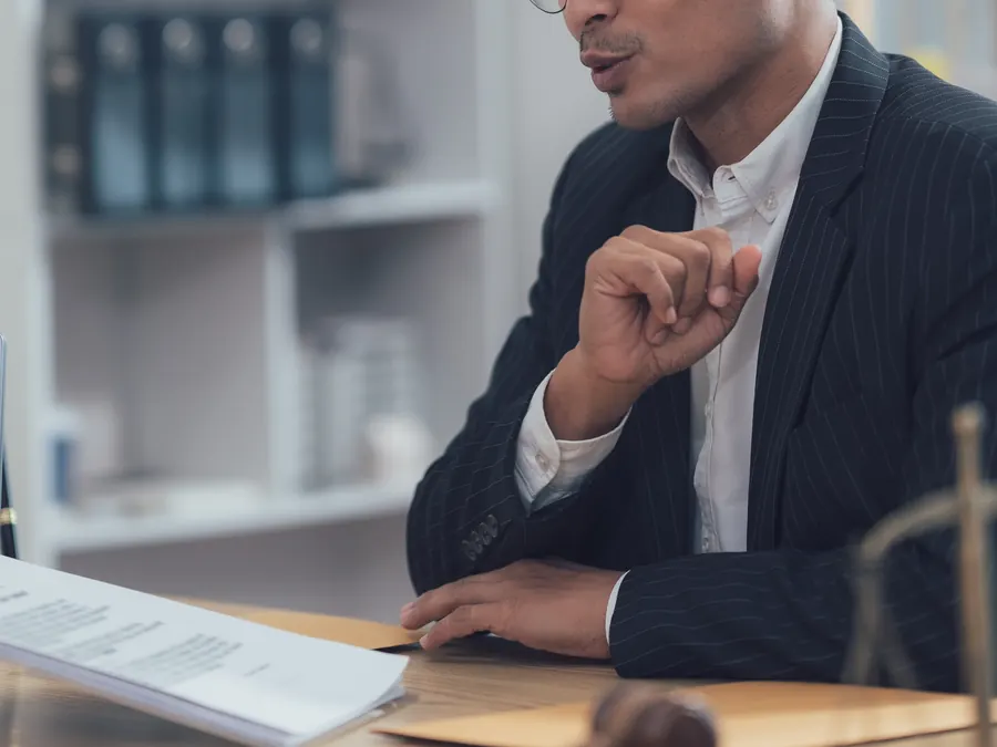A lawyer and a client reviewing documents.