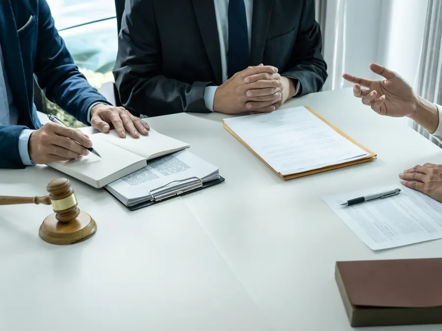A legal team meeting with a client.