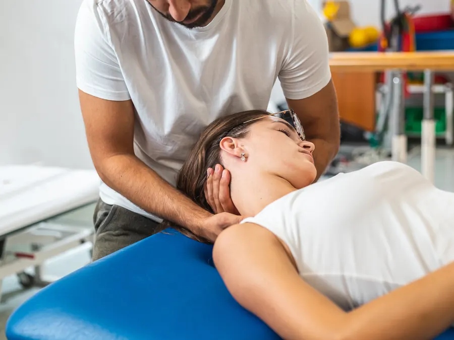 A physical therapist treating a patient.