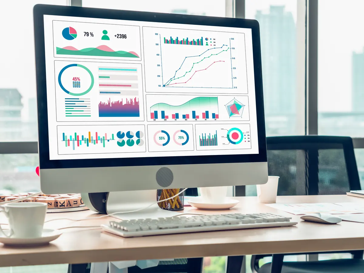 An analytics dashboard with traffic charts on a desktop monitor.