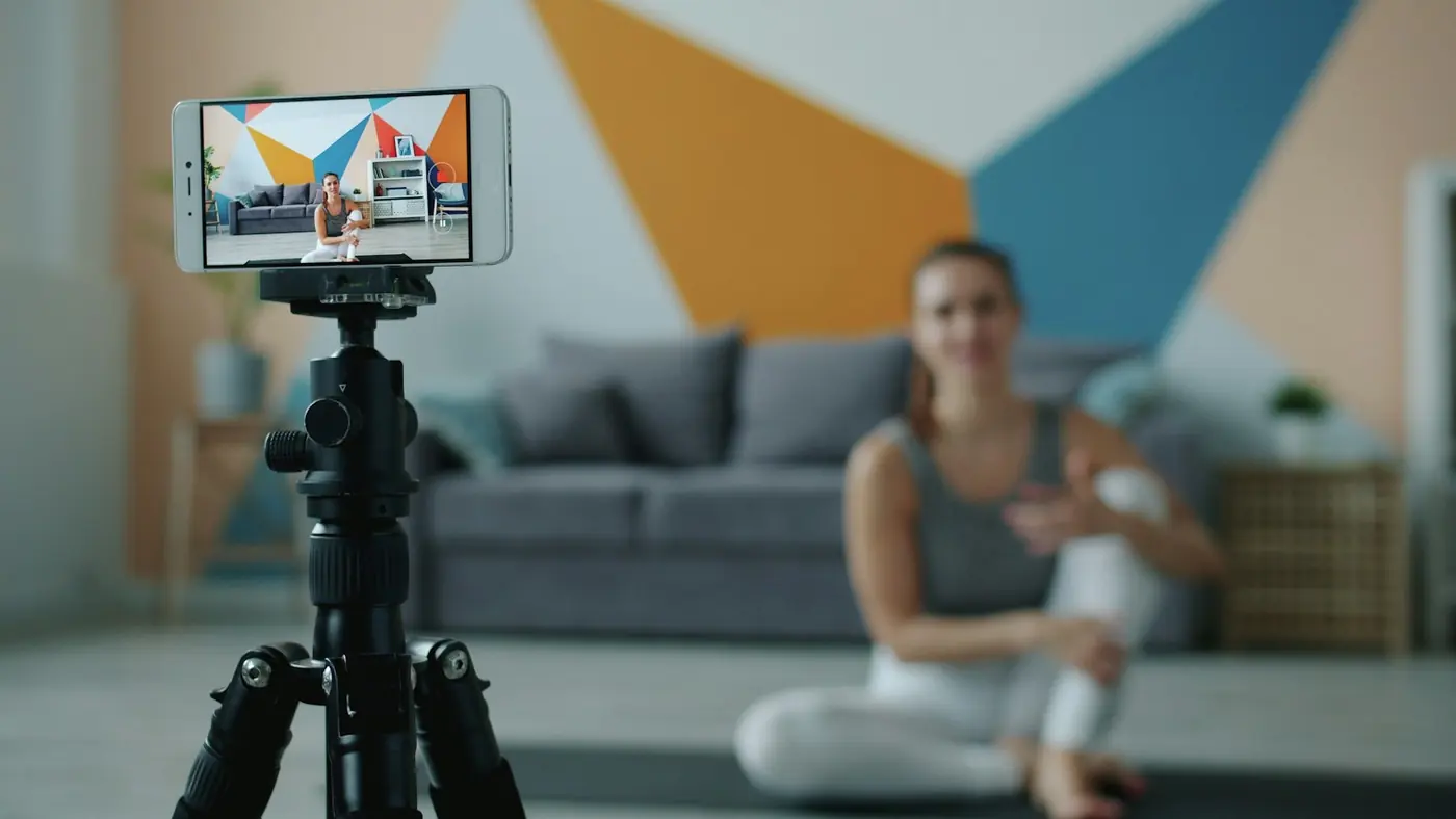 A creator filming a short video on a phone.