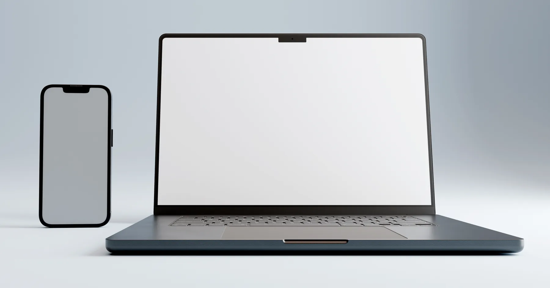 A MacBook Pro and an iPhone showing a website.