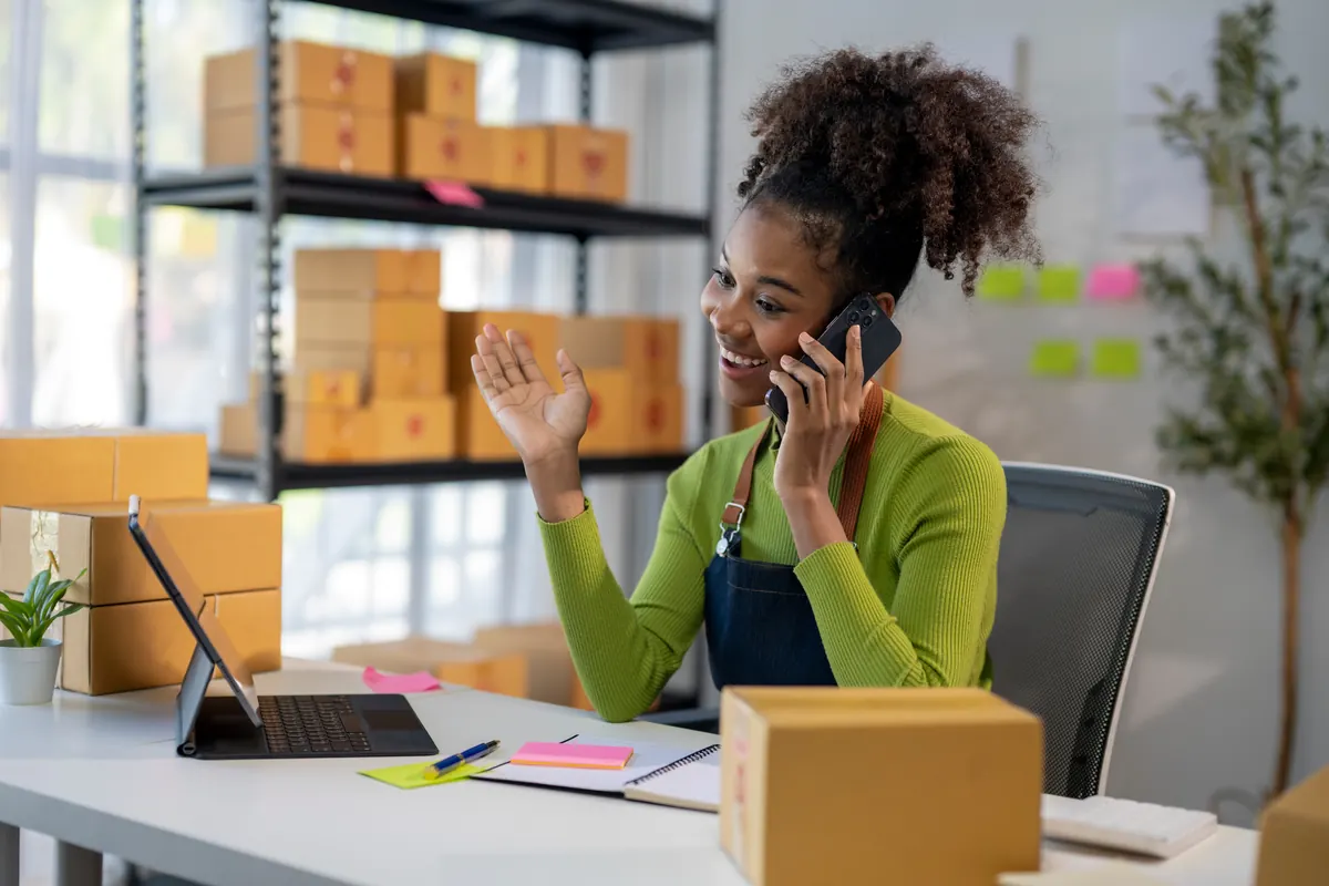 A business owner on a phone call.
